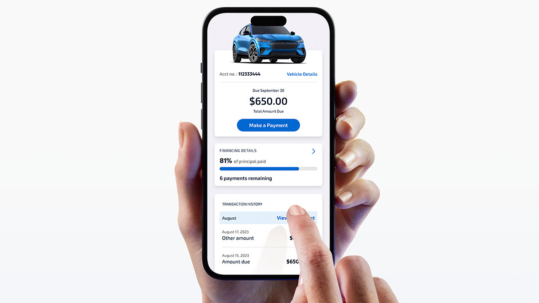 A person’s hands using a smartphone to access the Ford Credit Mobile App.